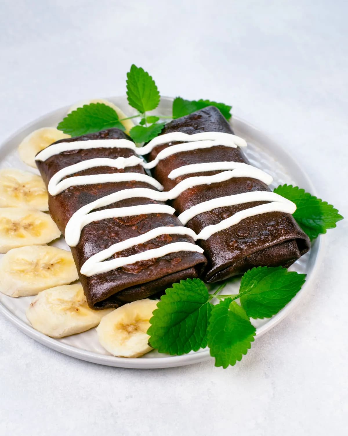 Chocolate crepes with cheese, banana, and nutella