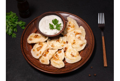 Potato pierogy (varenyky) with bacon crisps