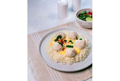 Chicken balls with rice and cheese sauce